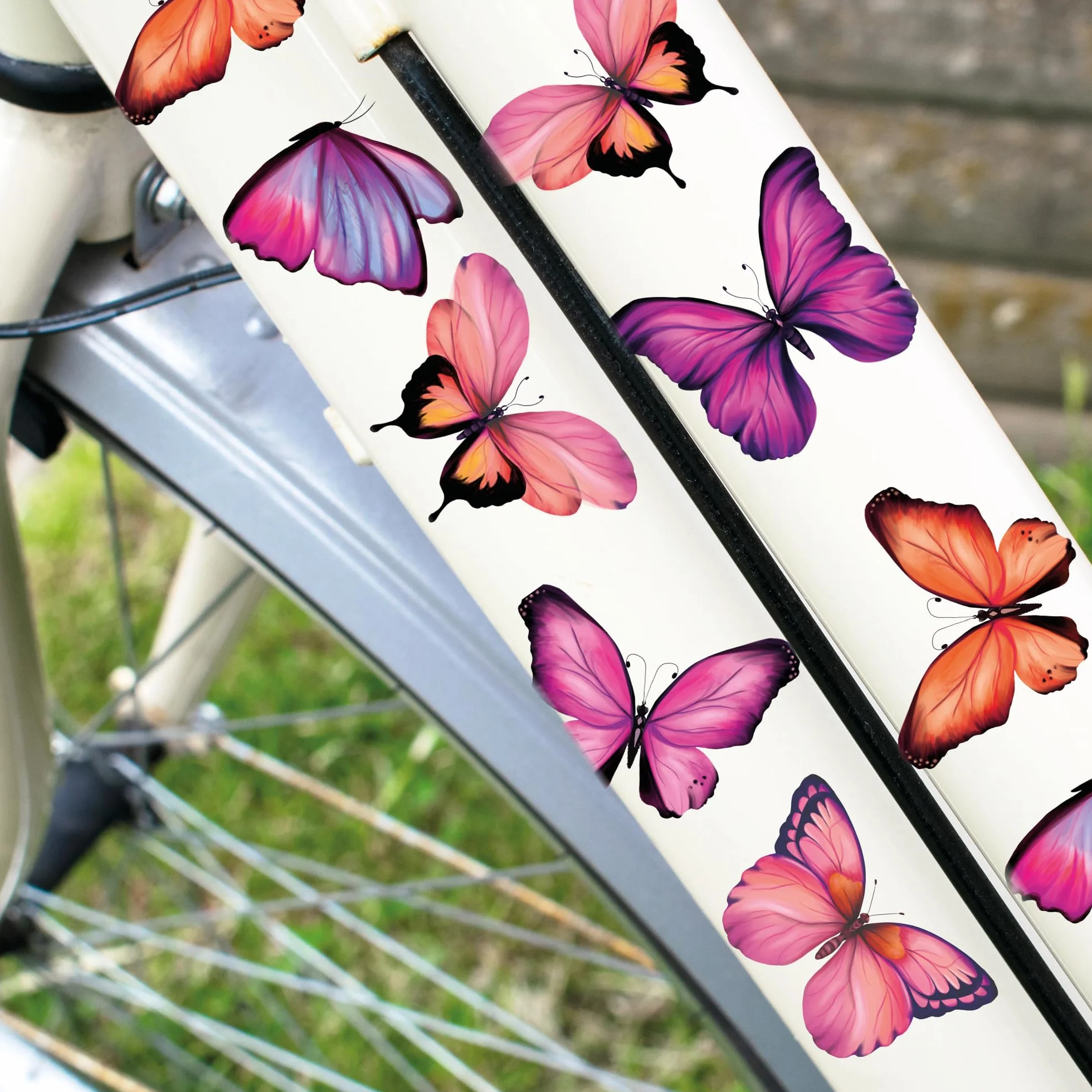 Naklejki rowerowe dla dzieci Motyw różowego motyla 34 sztuki Wandtattoo Loft